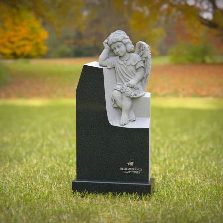 1240 - Angel Sitting on Granite Headstone – Elegant Memorial Tribute