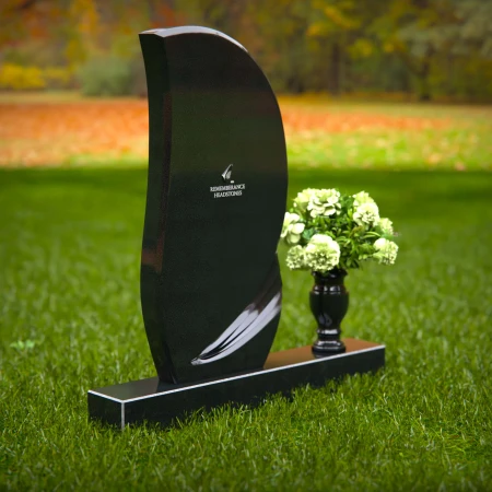 Modern curved headstones with single flower vase for memorials.
