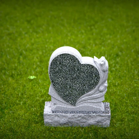 Carved hearts offer a peaceful message in graceful headstones