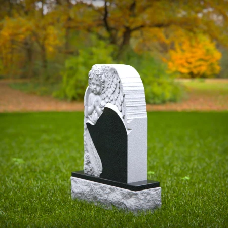 Cherished angel tombstones sculpted for youthful memory