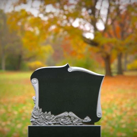 Love and memory entwined in scroll and rose carvings for grave markers