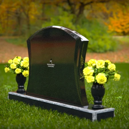 Waved granite headstones with dual flower vases for elegant tribute.