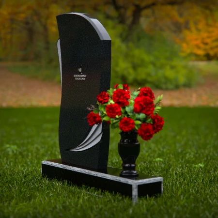 Modern headstones with artistic curves and a matching floral vase.