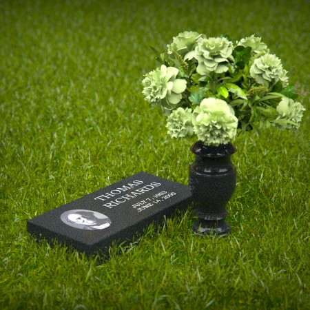 Compact headstones featuring photo inlays and floral vases for memorials.