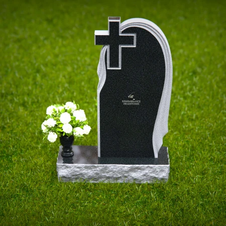Graceful asymmetrical granite headstones with cross, symbolizing faith and remembrance.