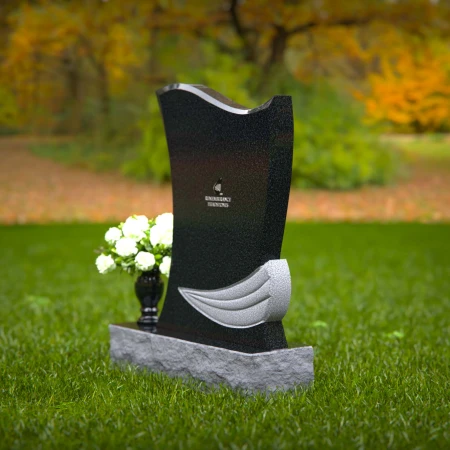 Elegant granite headstones with flowing contoured design and flower vase.