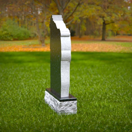 Mirrored faith elements wrapped in soft carving create heartfelt memorials