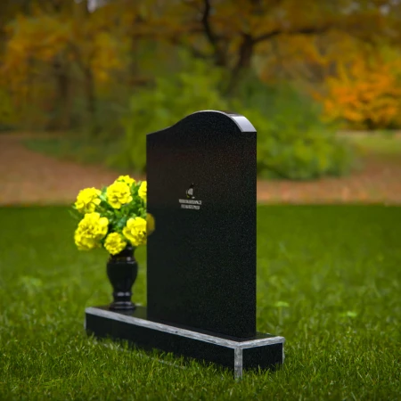 Elegant granite headstones with gently curved top and flower vase.