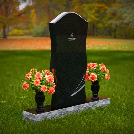 Elegant headstones with unique contours and dual flower vases.