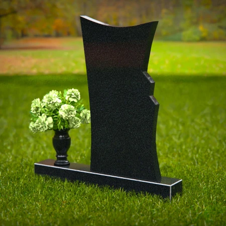 Contemporary headstones featuring a flowing design and floral vase.