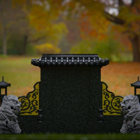 1897 - Serene Monument with Guardian Lion Statues in Tranquil Park Setting