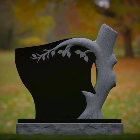 1928 - Nature-Inspired Monument with Carved Tree and Leaf Branch Design