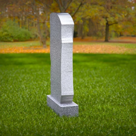 Carved forms reflect dignity and meaning in sculpted tombstones