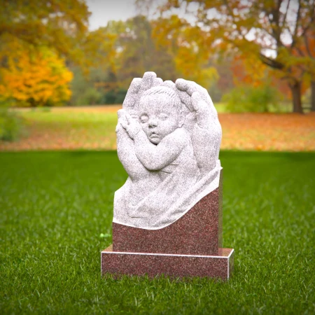 Sacred angel hands holding sleeping baby on headstones