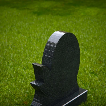 oval silhouette headstone etched with graceful leaves for headstone prices
