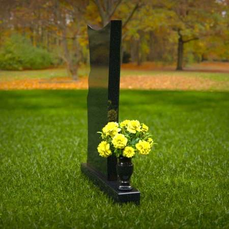 Contemporary granite memorial headstones with unique curved design.