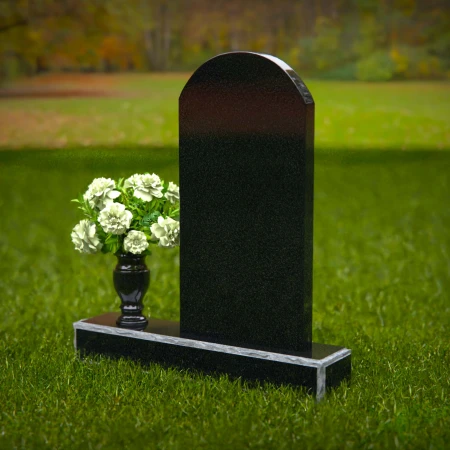 Classic arched headstones with a single flower vase for tribute.