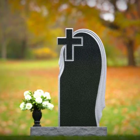 Graceful asymmetrical granite headstones with cross, symbolizing faith and remembrance.