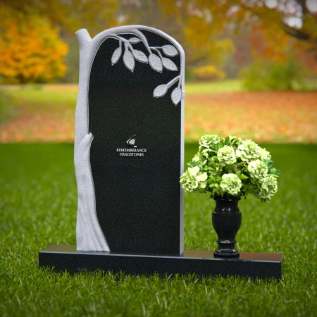 Elegant headstones featuring a tree design symbolizing growth and life.