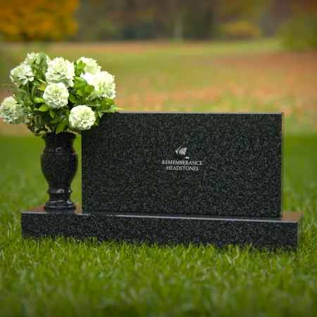 Elegant headstones featuring custom memorial designs and flower vases.