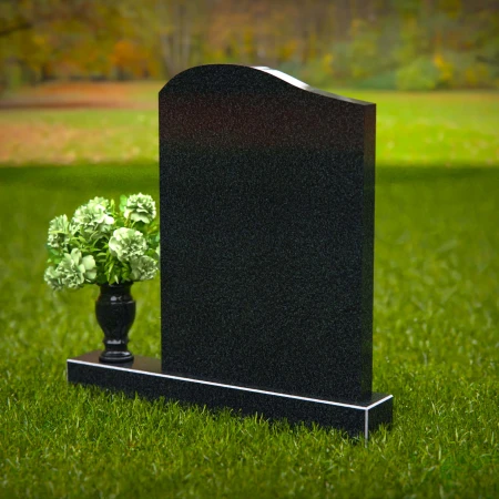 Timeless upright headstones with rounded top for elegant tribute.