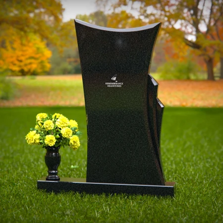 Contemporary granite memorial headstones with unique curved design.