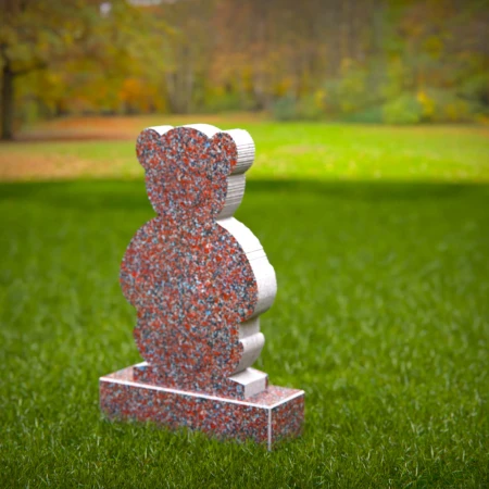 Sympathetic grave markers for kids featuring plaque-holding teddy