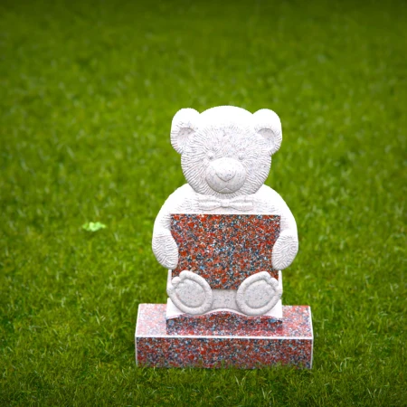 Sympathetic grave markers for kids featuring plaque-holding teddy