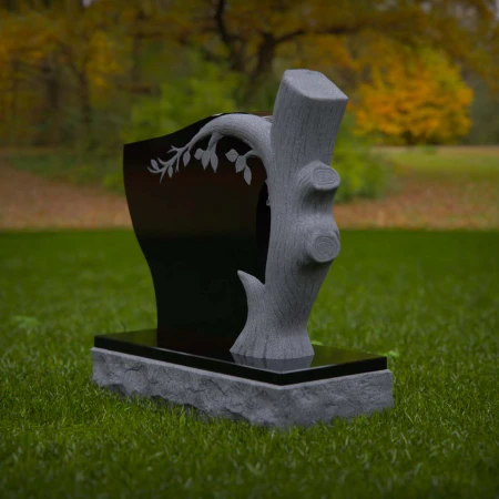 1928 - Nature-Inspired Monument with Carved Tree and Leaf Branch Design