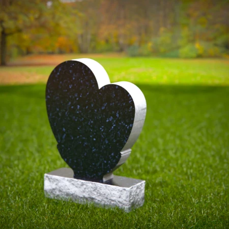 Comforting headstones with sculpted hands gently cupping heart