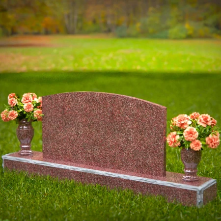 Dual vase headstones with arched design honoring shared memories.