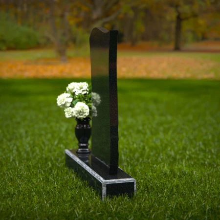 Modern curved granite headstones with engraved detailing for tribute.