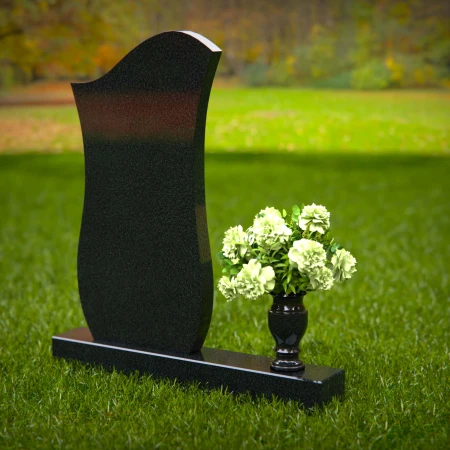 Contemporary granite headstones with unique curved design and vase.