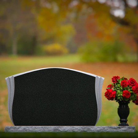Elegant contoured headstones with flower vase for refined tribute.