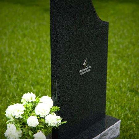 Elegant sloped headstones with floral vase for timeless tribute.