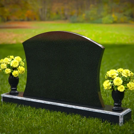 Waved granite headstones with dual flower vases for elegant tribute.