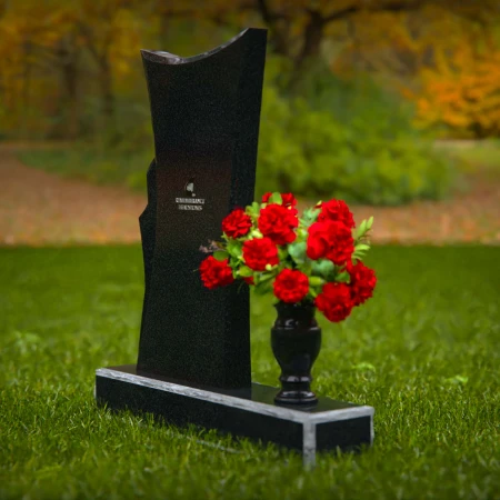 Contemporary granite headstones with unique shape and flower vase.