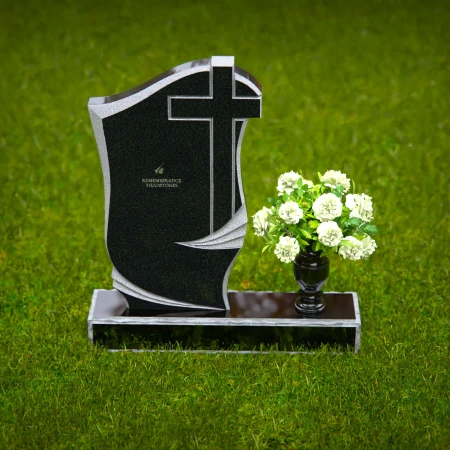Traditional granite headstones with cross design and flower vase.