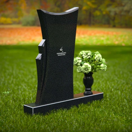 Contemporary headstones featuring a flowing design and floral vase.
