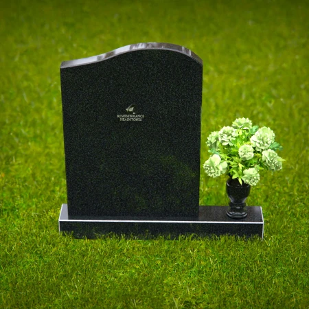 Timeless upright headstones with rounded top for elegant tribute.