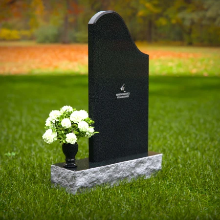 Elegant sloped headstones with floral vase for timeless tribute.