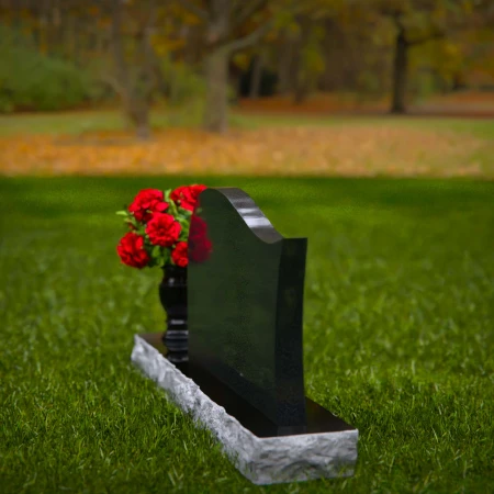Modern waved granite headstones with flower vase for peaceful tribute.