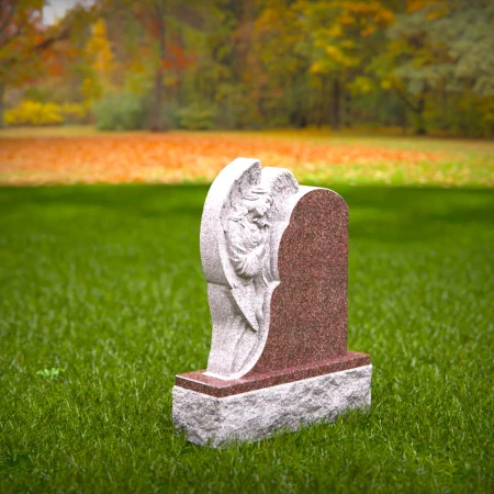 Graceful presence keeps memory alive through memorials, headstone, and grave ornaments.