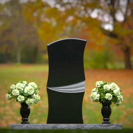 Elegant curved granite headstones with a timeless memorial design.