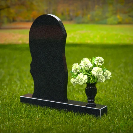 Contemporary headstones with curved artistic design and floral vase.