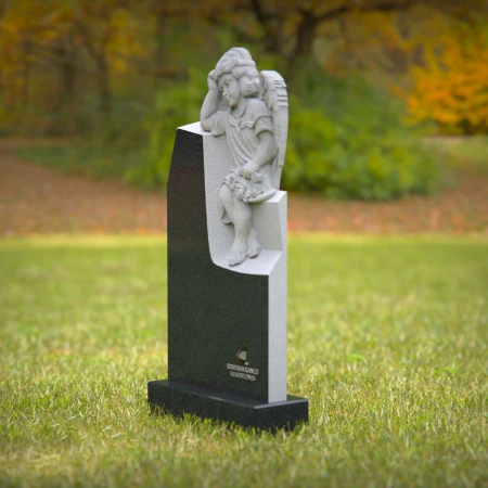1240 - Angel Sitting on Granite Headstone – Elegant Memorial Tribute
