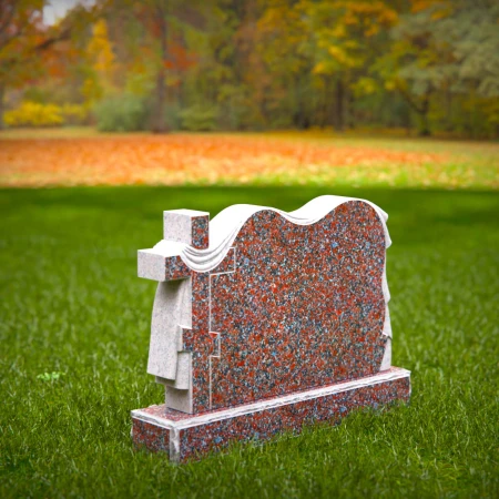 A meaningful cross tribute enhanced by elegant cloth motifs in headstone prices