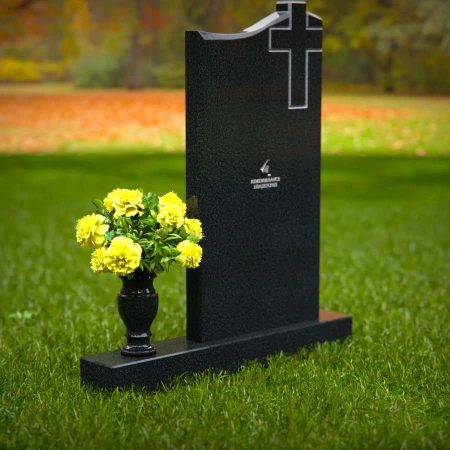 Upright granite headstones with cross design and flower vase.