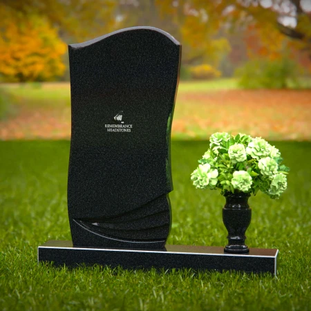 Elegant curved granite headstones with layered detailing for timeless memorials.
