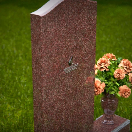 Modern upright headstones with gentle curves and vase tribute.
